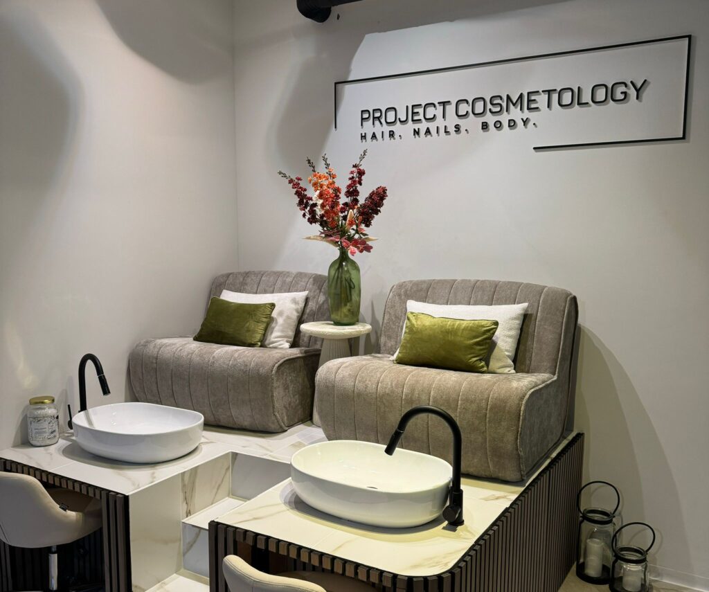 Cosmetology salon seating with wash basins.